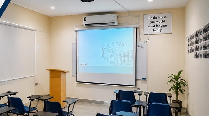 Mannat Institute smart classroom with projector and whiteboard